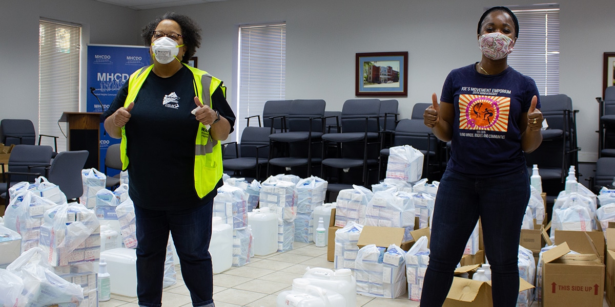 resources-covid Photograph of two women of color working to distribute supplies